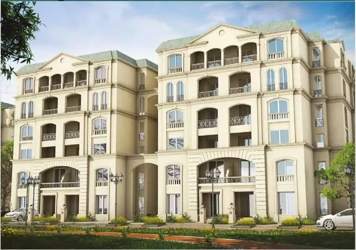Two buildings with arched balconies and green roofs in L'Avenir