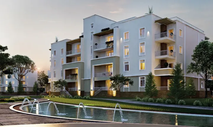 عمارة بيضاء ونافورة أمامها في أكتوبر بلازا سوديك
