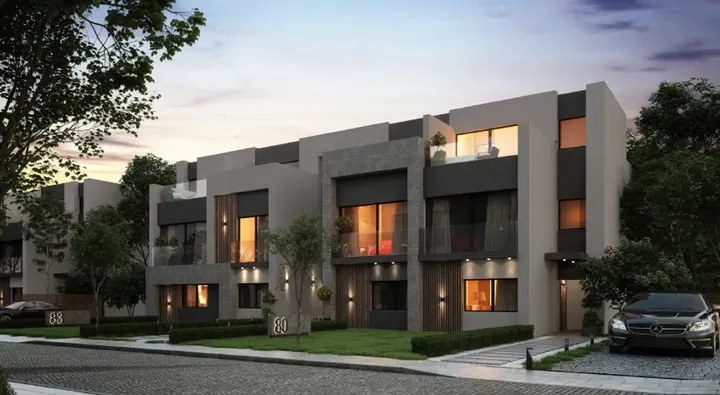 Contemporary townhouse facade at dusk in Rare
