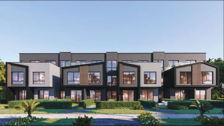 Row of grey townhouses with timber cladding at The Ridge