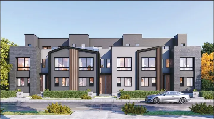 Row of homes with dark stone facades at The Ridge